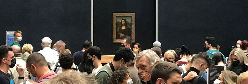 masked crowd in line to see the Mona Lisa